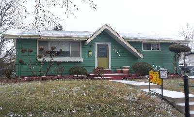 2835 Eaton Street Wheat Ridge, CO 80214 - Photo 1 of 1 a front view of a house with garden