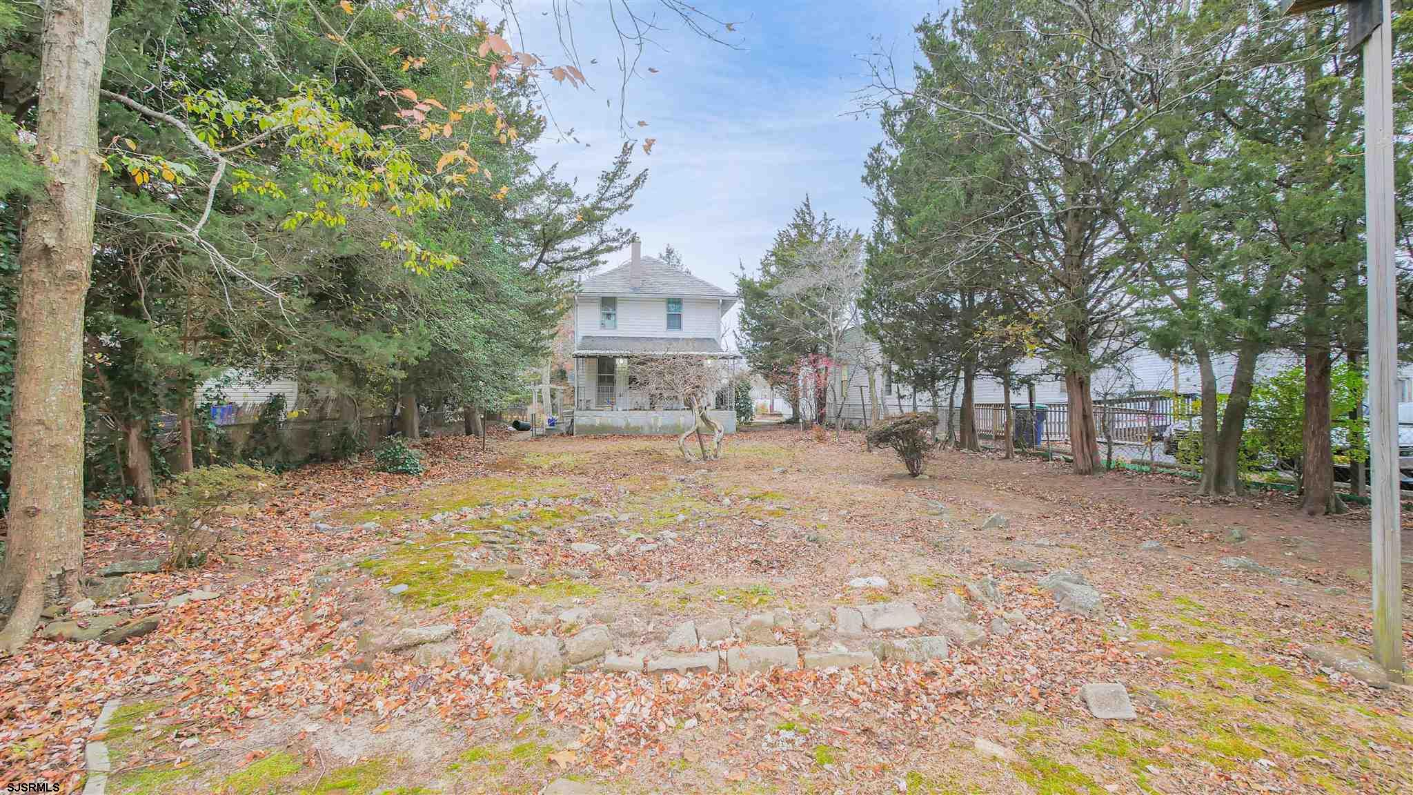 1414 Shore Road Northfield, NJ 08225 - Photo 17 of 19 a view of a yard with plants and trees