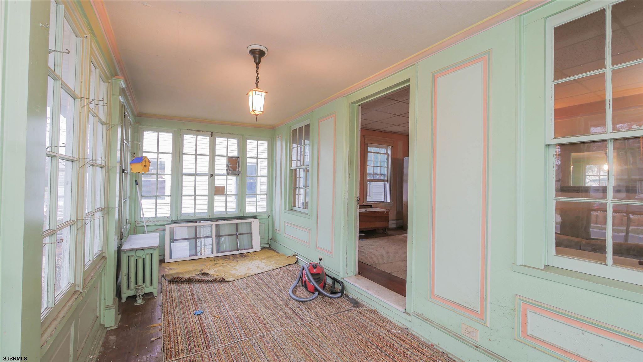 1414 Shore Road Northfield, NJ 08225 - Photo 2 of 19 a very nice looking room with wooden floor and a window