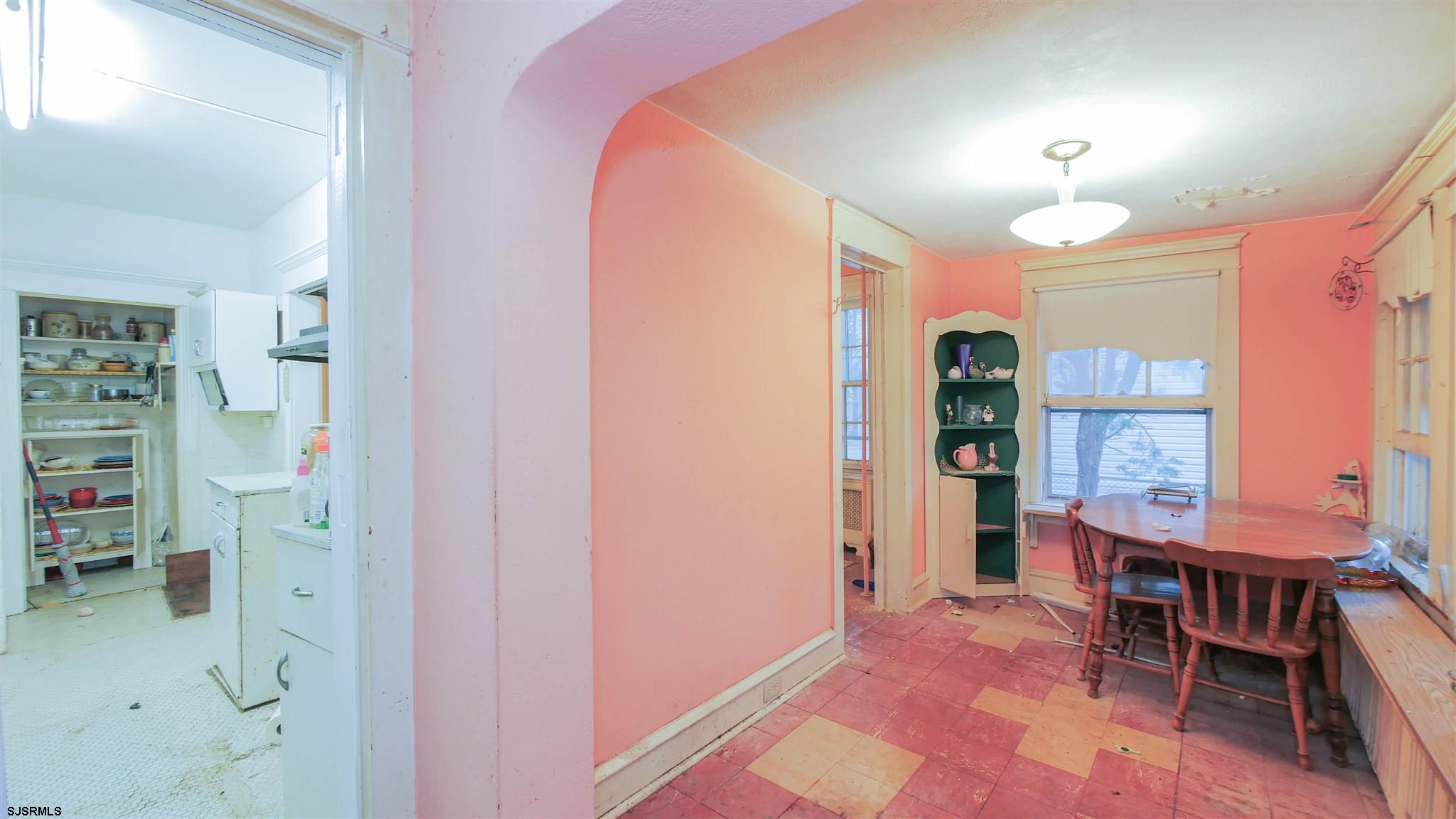 1414 Shore Road Northfield, NJ 08225 - Photo 7 of 19 an empty room with piano and wooden floor
