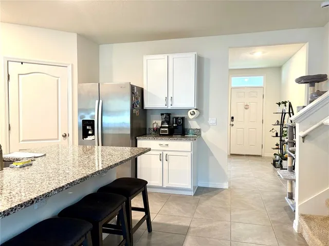 a living room with couches and a flat screen tv