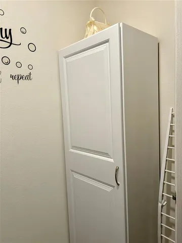 a view of a kitchen from the hallway