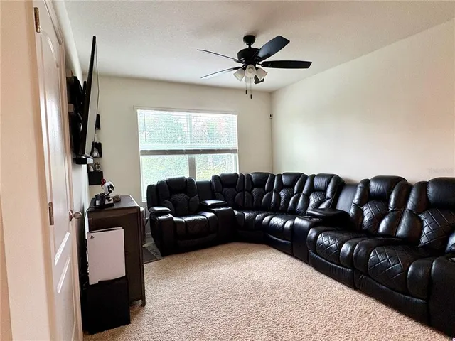 a bedroom with a bed and a television