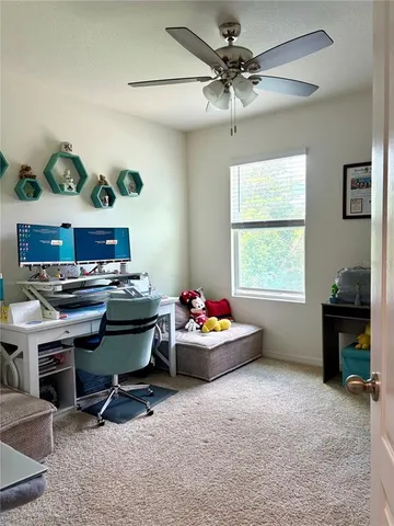 a bedroom with furniture and a wooden floor