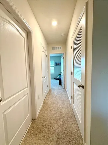 a bedroom with furniture and a flat screen tv