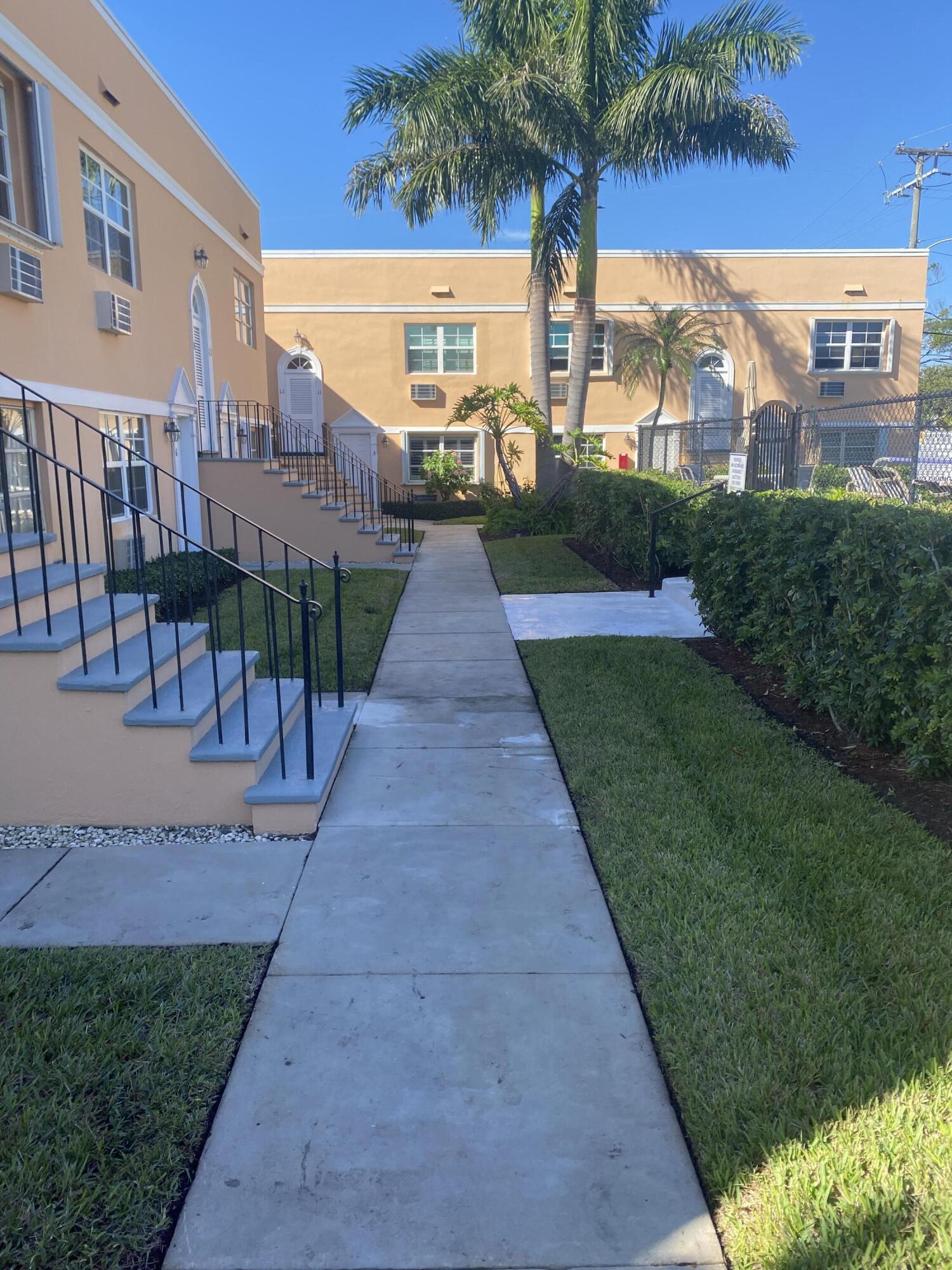 101 South Golfview Road, Unit 5 Lake Worth Beach, FL 33460 - Photo 1 of 17 a view of a street with a building in the background