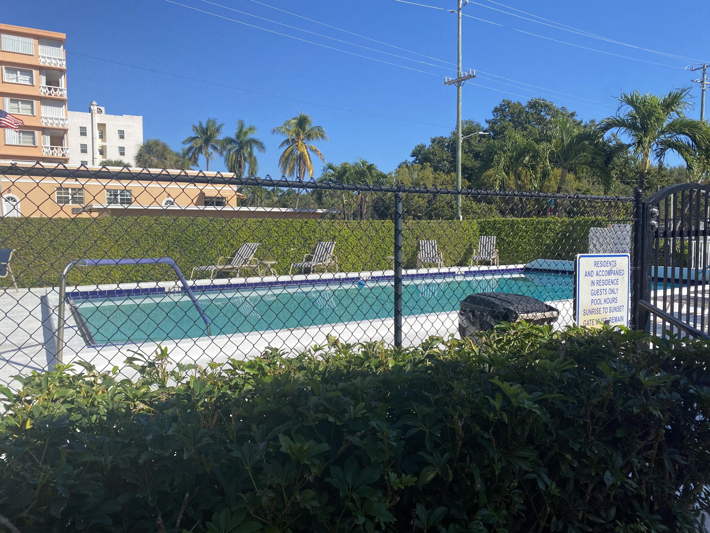 101 South Golfview Road, Unit 5 Lake Worth Beach, FL 33460 - Photo 3 of 17 a view of a lake with a building in the background