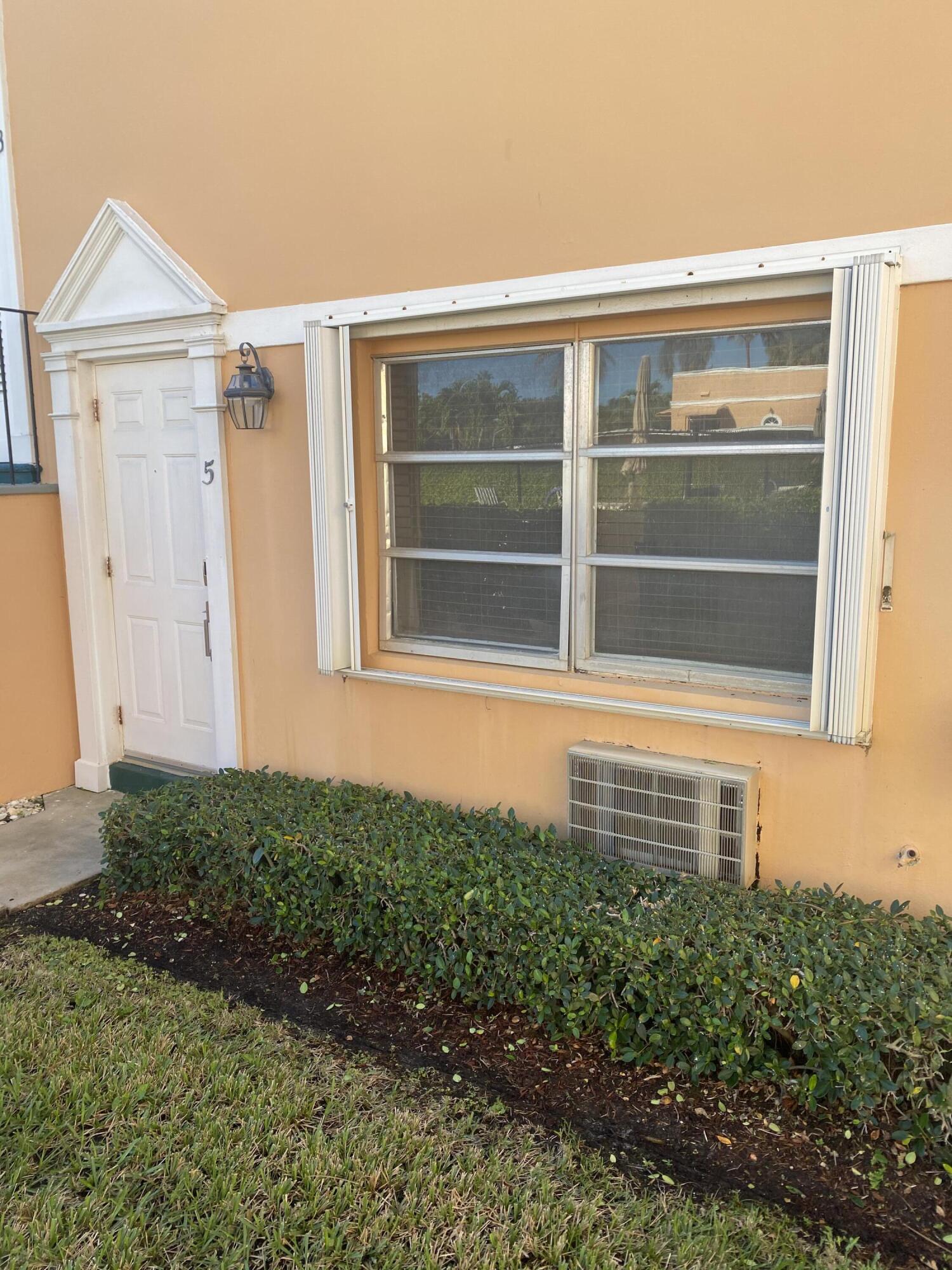 101 South Golfview Road, Unit 5 Lake Worth Beach, FL 33460 - Photo 6 of 17 a view of house with backyard