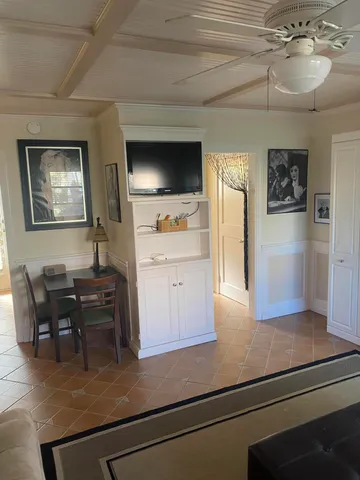 a kitchen with kitchen island a refrigerator stove and sink