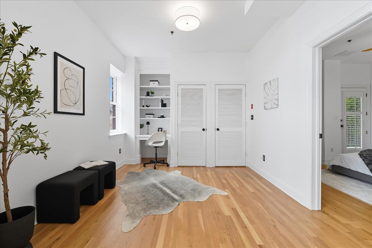 829 Washington Street, Unit 8 Hoboken, NJ 07030 - Photo 12 of 36 a bedroom with a bed and a couch