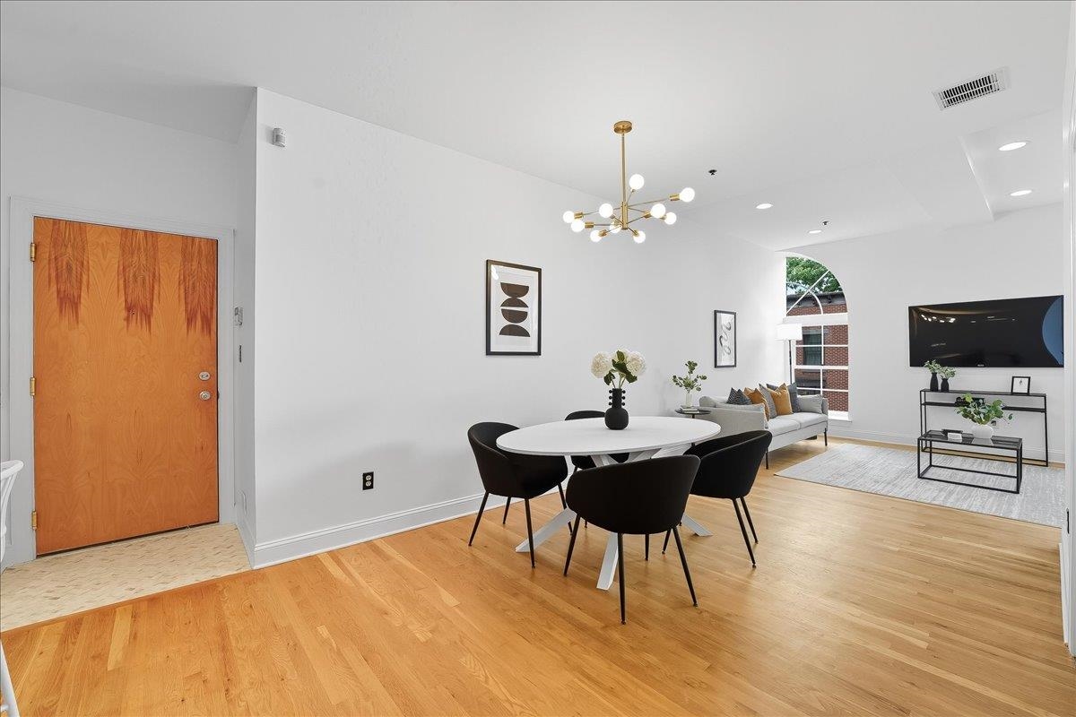 829 Washington Street, Unit 8 Hoboken, NJ 07030 - Photo 14 of 36 a view of a dining room with furniture and wooden floor