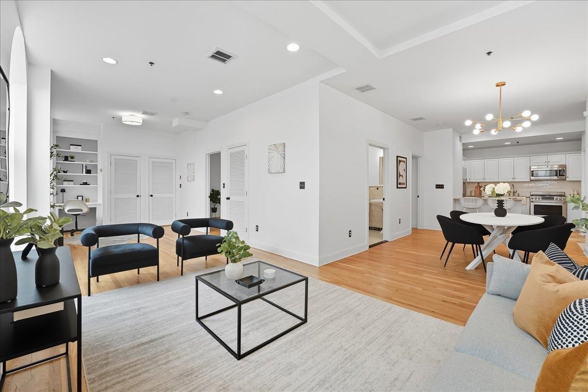 829 Washington Street, Unit 8 Hoboken, NJ 07030 - Photo 2 of 36 a living room with furniture and wooden floor