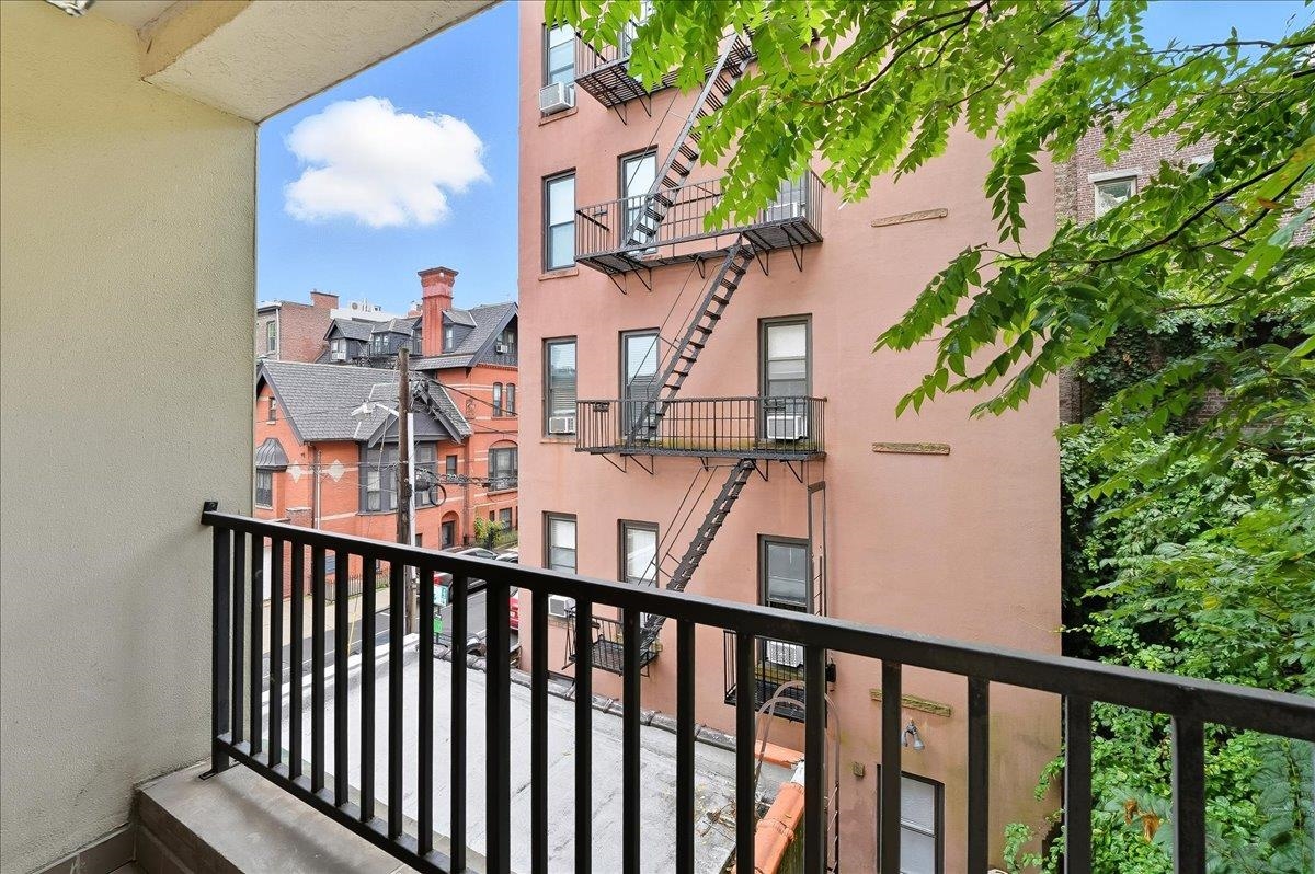 829 Washington Street, Unit 8 Hoboken, NJ 07030 - Photo 24 of 36 a view of a balcony with a tree