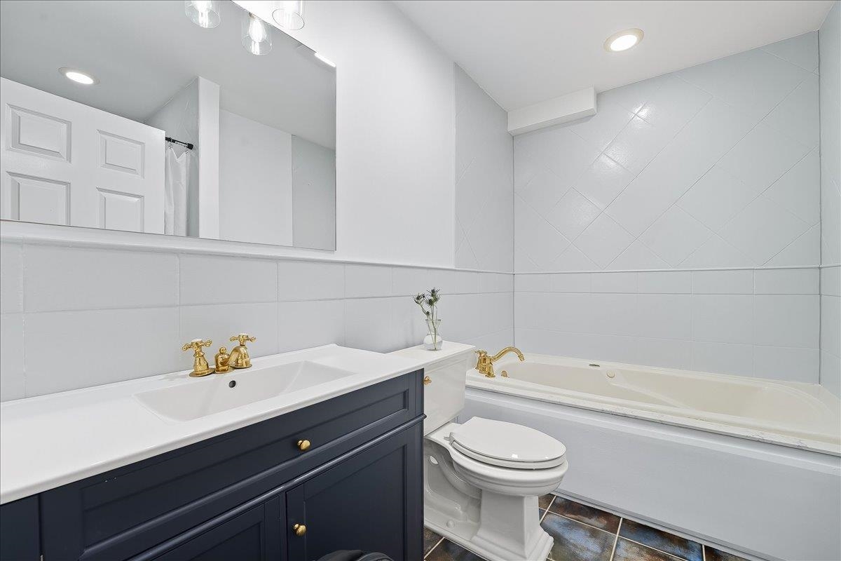 829 Washington Street, Unit 8 Hoboken, NJ 07030 - Photo 25 of 36 a bathroom with a sink a toilet and a bathtub