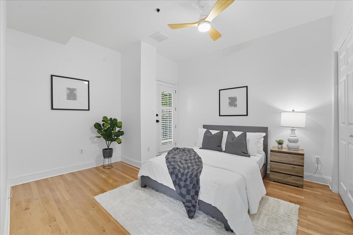 829 Washington Street, Unit 8 Hoboken, NJ 07030 - Photo 26 of 36 a bed room with bed and paintings on the wall