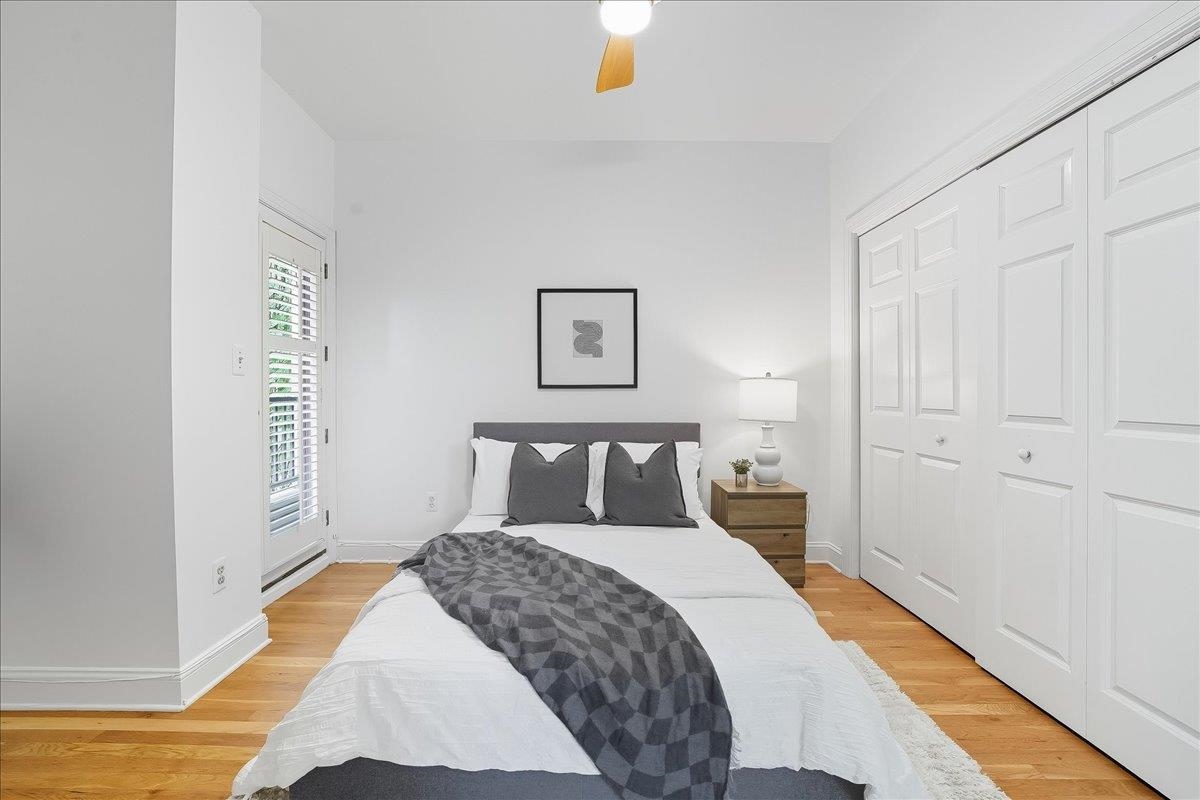 829 Washington Street, Unit 8 Hoboken, NJ 07030 - Photo 27 of 36 a bedroom with a bed and painting on the wall