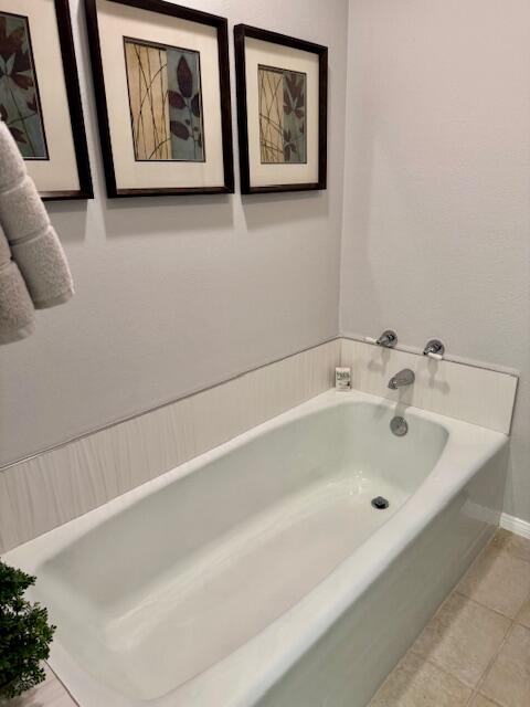 118 Racquet Club Drive South Rancho Mirage, CA 92270 - Photo 13 of 33 a white bath tub sitting next to a white wall