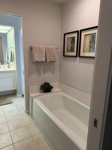 a bathroom with a sink a vanity and a mirror