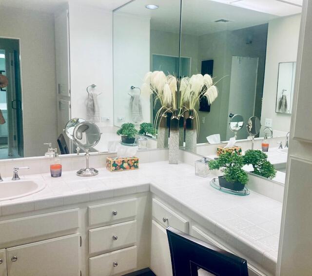 118 Racquet Club Drive South Rancho Mirage, CA 92270 - Photo 15 of 33 a bathroom with a sink a vanity and a mirror