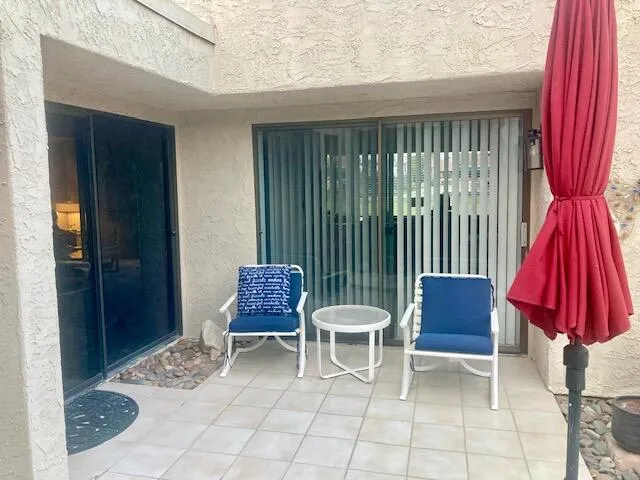 a building outdoor space with lots of tables and chairs