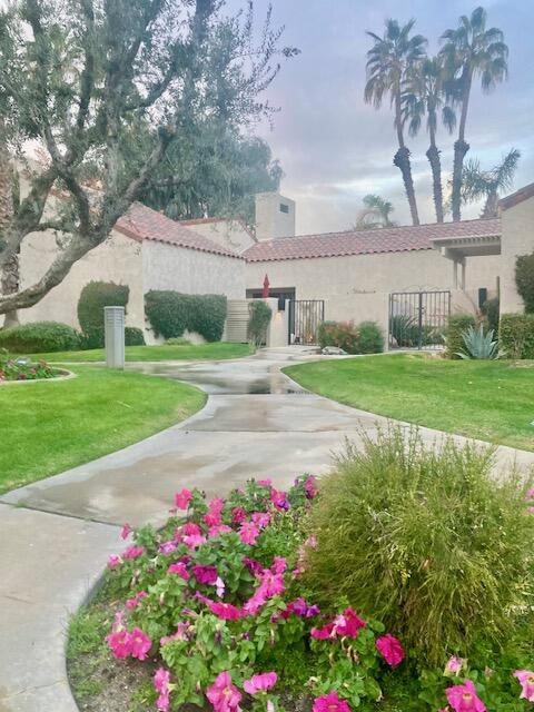 118 Racquet Club Drive South Rancho Mirage, CA 92270 - Photo 21 of 33 a view of a house with a big yard and potted plants
