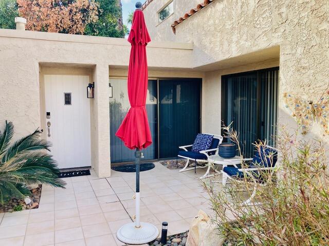 118 Racquet Club Drive South Rancho Mirage, CA 92270 - Photo 22 of 33 a building outdoor space with lots of tables and chairs
