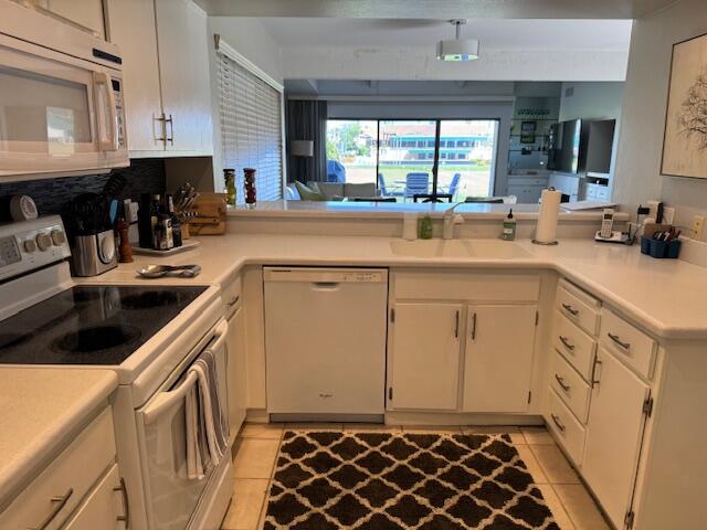 118 Racquet Club Drive South Rancho Mirage, CA 92270 - Photo 24 of 33 a kitchen with a sink and cabinets