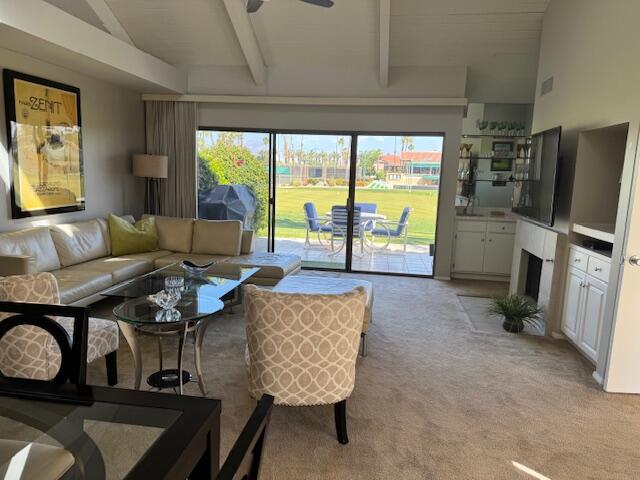 118 Racquet Club Drive South Rancho Mirage, CA 92270 - Photo 28 of 33 a living room with furniture and a floor to ceiling window