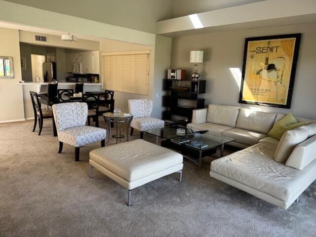 118 Racquet Club Drive South Rancho Mirage, CA 92270 - Photo 9 of 33 a living room with couches and a potted plant on table