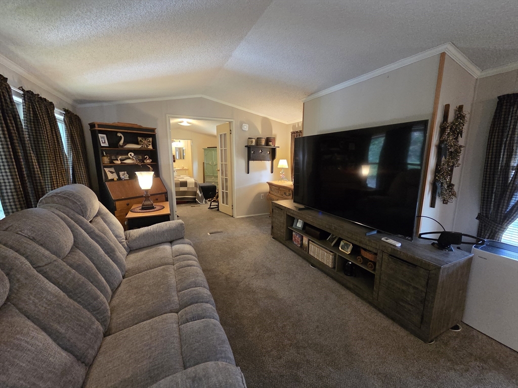 72 Holiday Circle Chicopee, MA 01020 - Photo 9 of 16 a living room with furniture and a flat screen tv