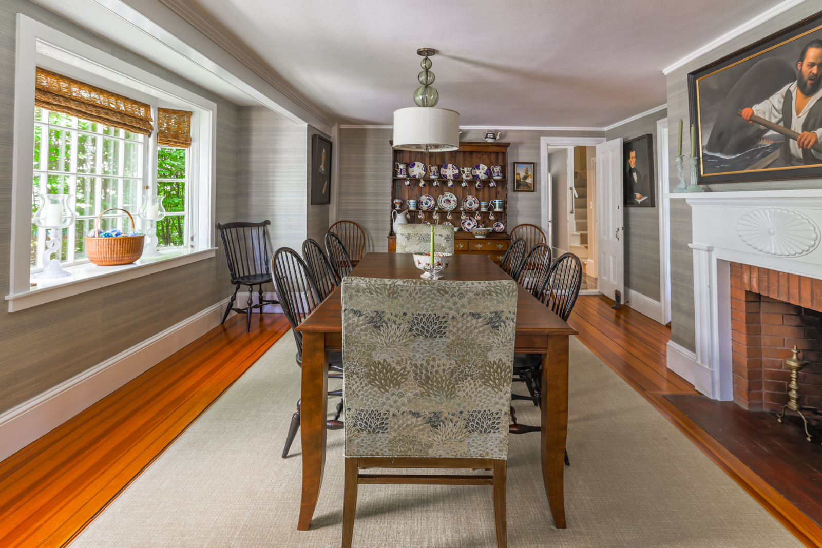 12 Hussey Street Nantucket, MA 02554 - Photo 5 of 47 a dining room with furniture a fireplace and wooden floor