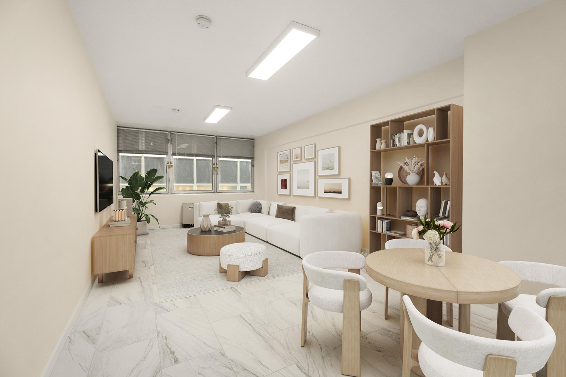a living room with furniture and a view of kitchen
