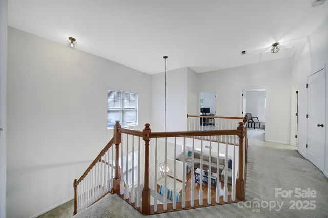 a view of a hallway with a furniture