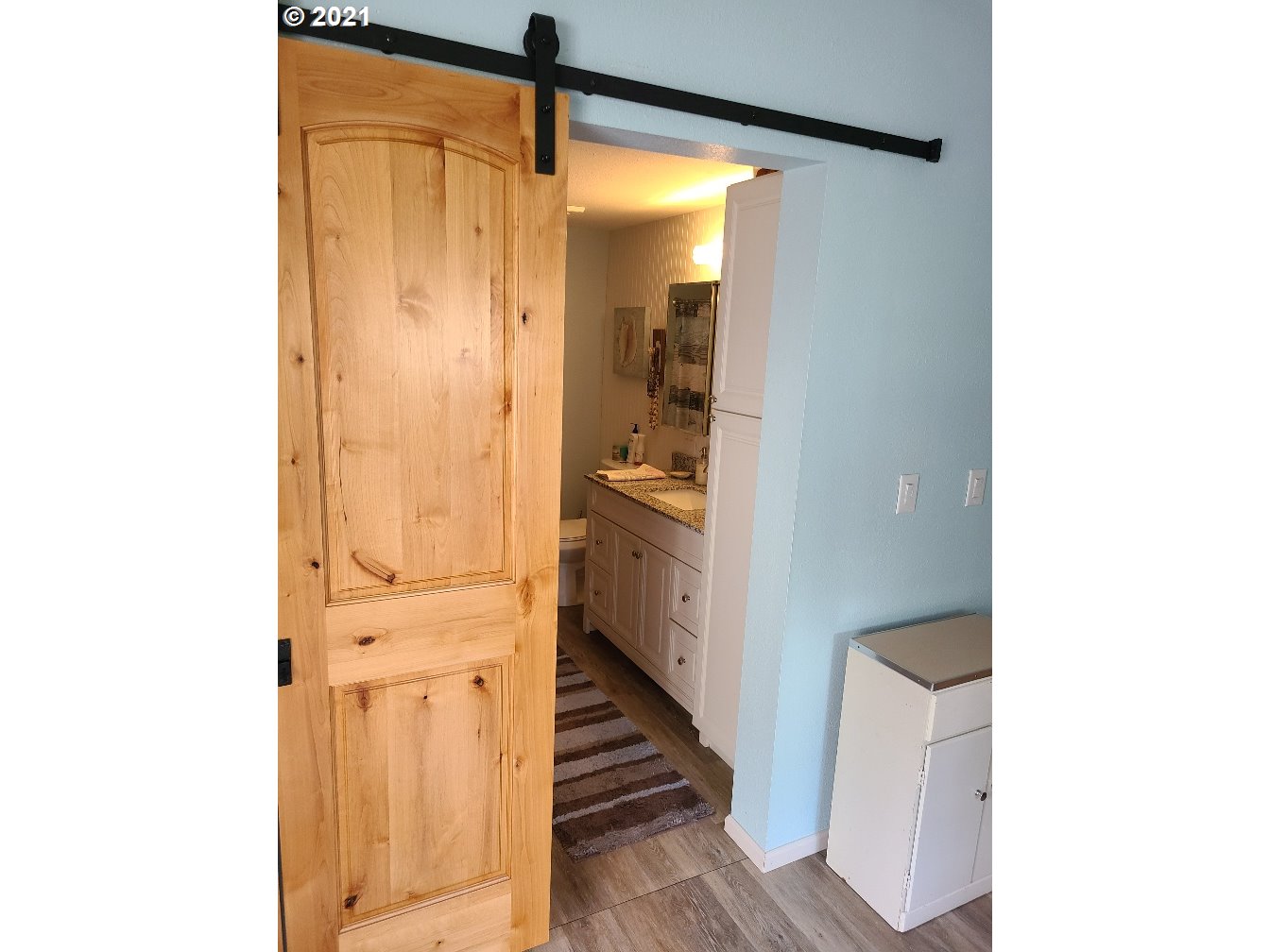 9024 173rd Avenue Southwest Rochester, WA 98579 - Photo 5 of 16 a view of a hallway with wooden floor