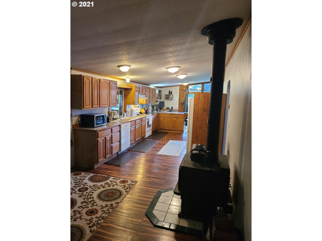 9024 173rd Avenue Southwest Rochester, WA 98579 - Photo 7 of 16 a kitchen with stainless steel appliances granite countertop a refrigerator and a stove top oven