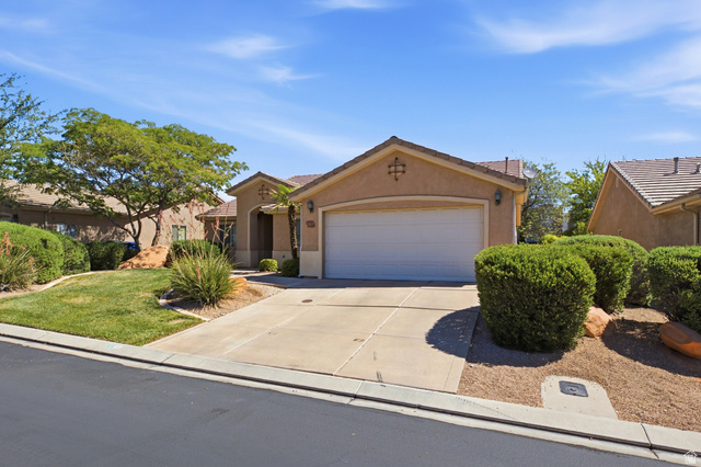 1630 East 2450th Street South, Unit 263 St. George, UT 84790 - Photo 24 of 24 Stucco exterior with a tiled roof and an attached garage