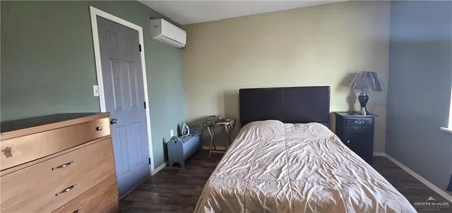 a bed room with a bed and a dresser