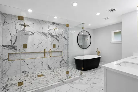 a bathroom with a sink toilet and a mirror