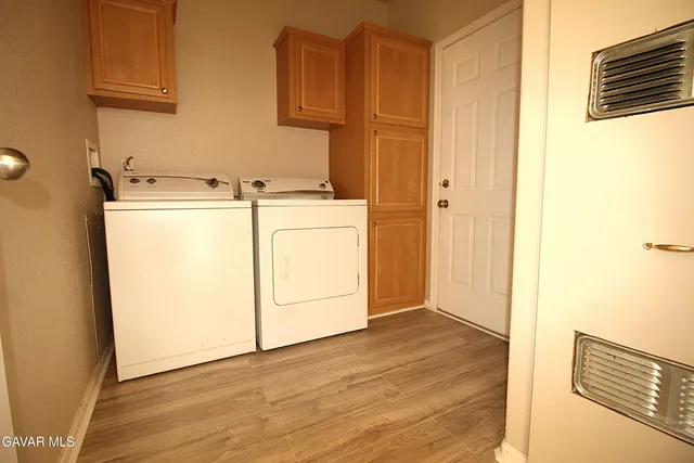 a view of a storage & utility room with washer and dryer