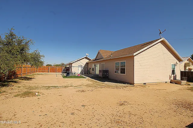 a view of a house with snow in the yard