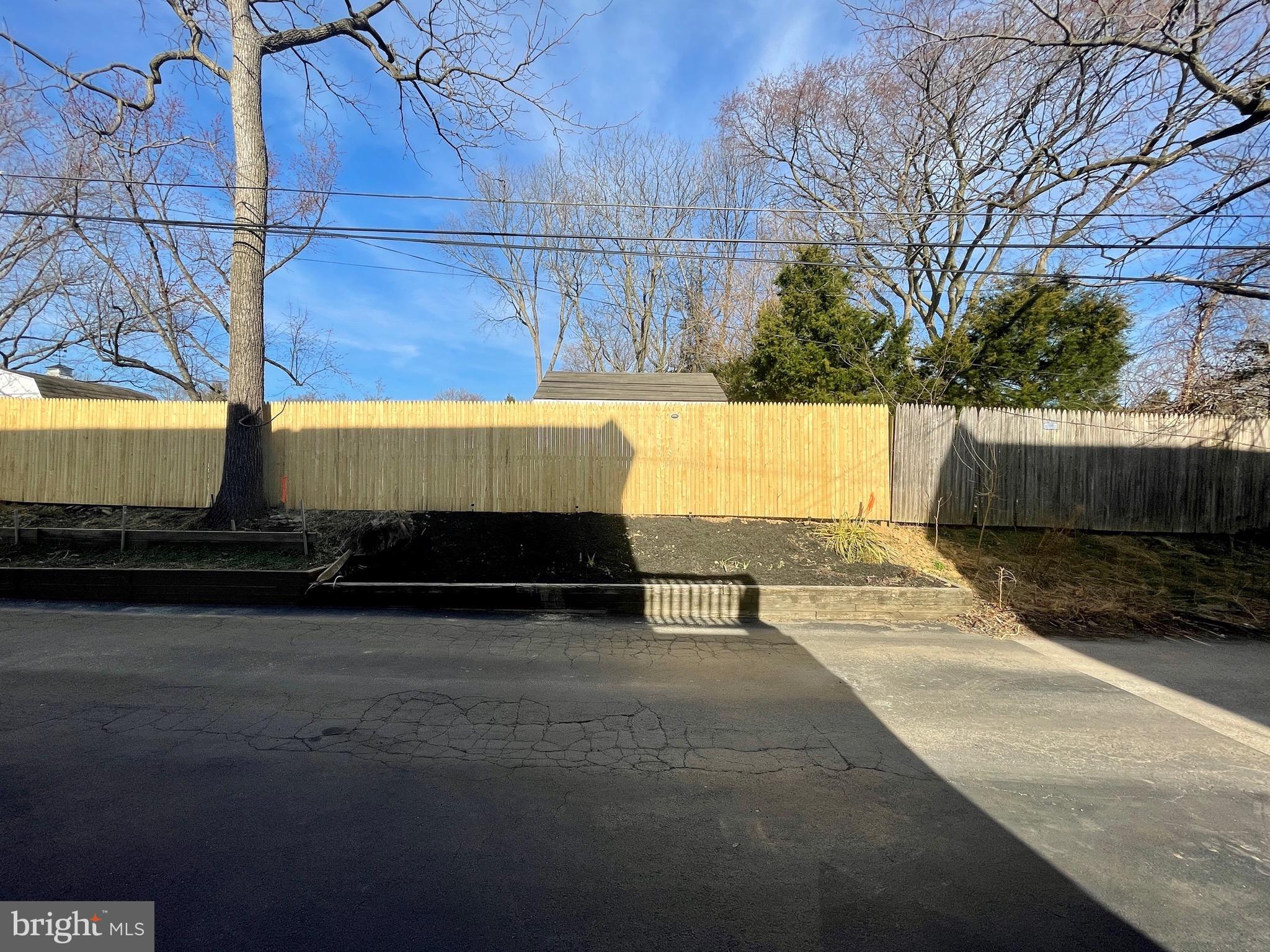59 Greenhill Road Media, PA 19063 - Photo 16 of 52 Back alley with flower bed & retaining wall