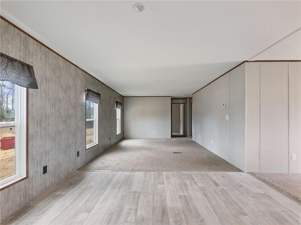 5226 Bogus Road Commerce, GA 30530 - Photo 13 of 41 a view of empty room with wooden floor and fan