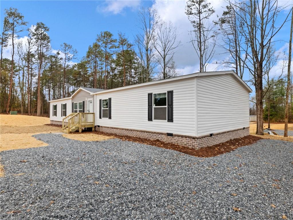 5226 Bogus Road Commerce, GA 30530 - Photo 35 of 41 a view of a house with a yard