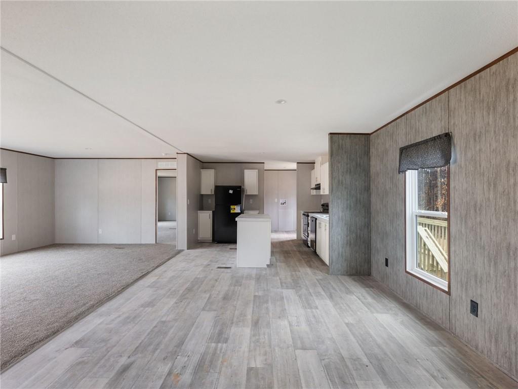 5226 Bogus Road Commerce, GA 30530 - Photo 6 of 41 a view of a big room with wooden floor and windows