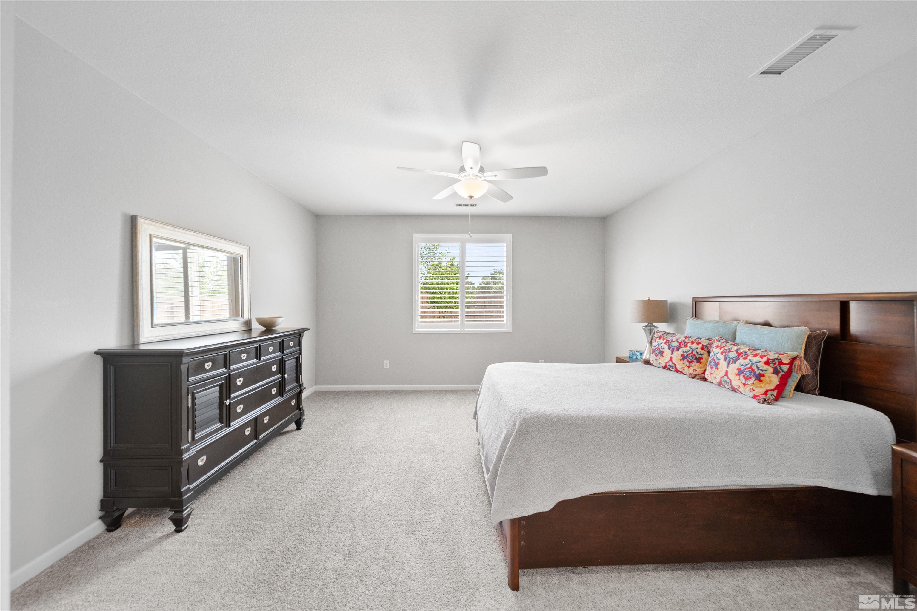 449 Scenic Ridge Drive Reno, NV 89506 - Photo 15 of 22 a bedroom with a bed and a dresser