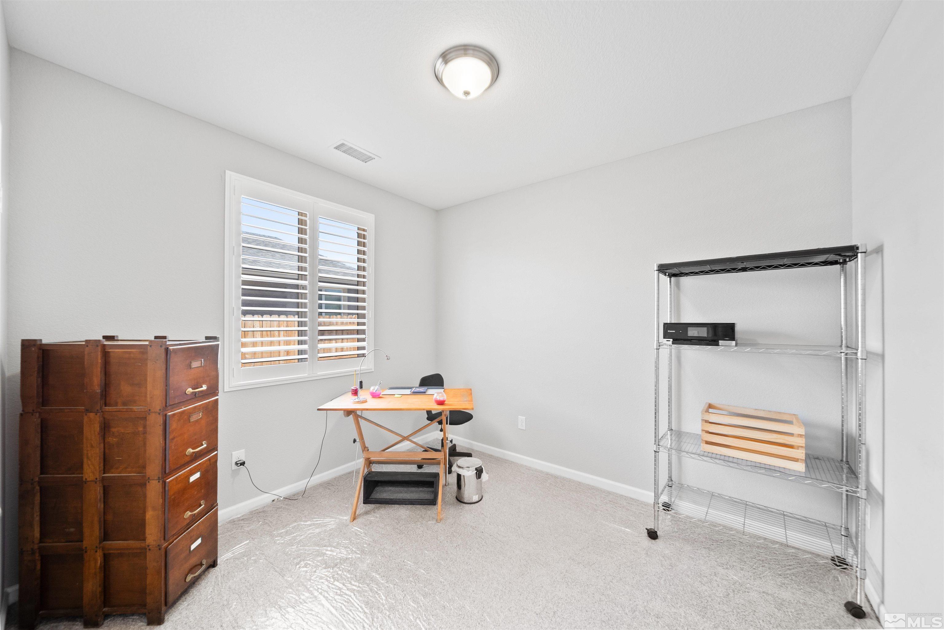 449 Scenic Ridge Drive Reno, NV 89506 - Photo 18 of 22 a room with furniture and a window