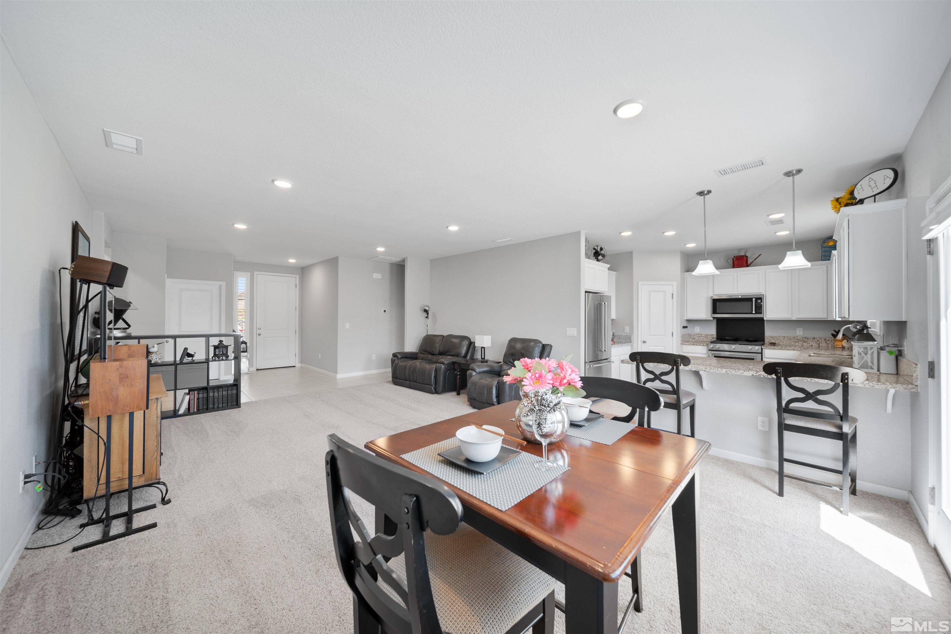 449 Scenic Ridge Drive Reno, NV 89506 - Photo 3 of 22 a large kitchen with a table and chairs