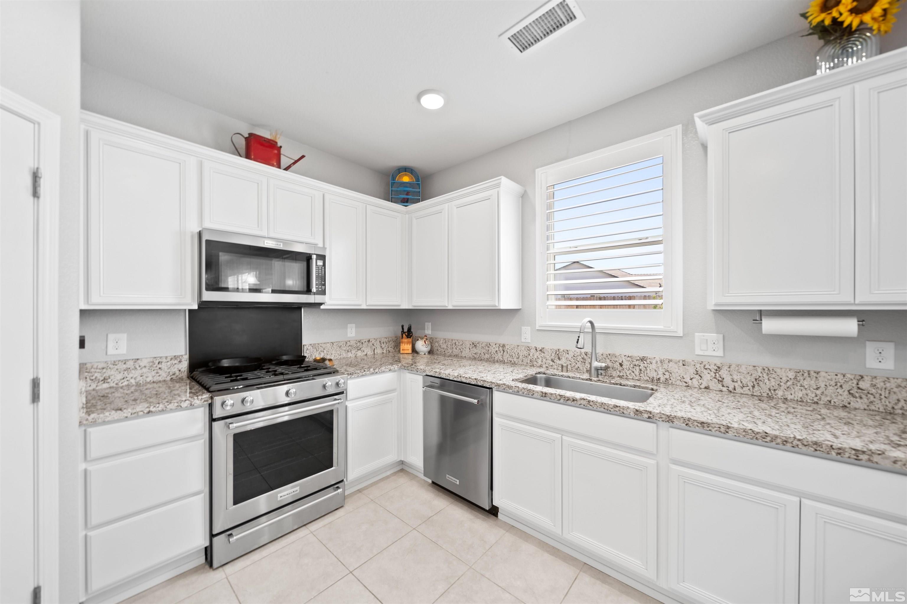 449 Scenic Ridge Drive Reno, NV 89506 - Photo 5 of 22 a kitchen with appliances a sink and a window