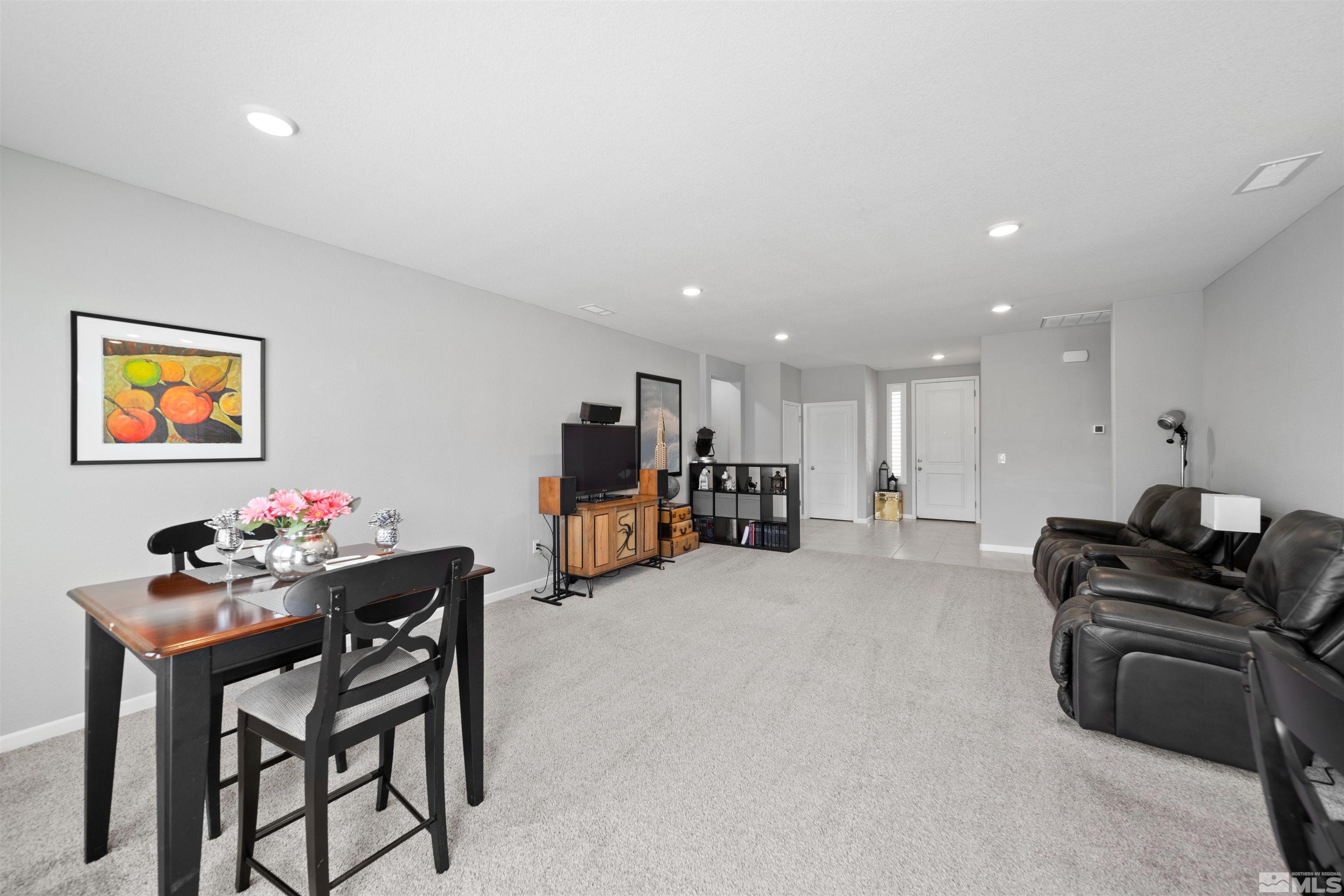 449 Scenic Ridge Drive Reno, NV 89506 - Photo 9 of 22 a living room with furniture and a flat screen tv