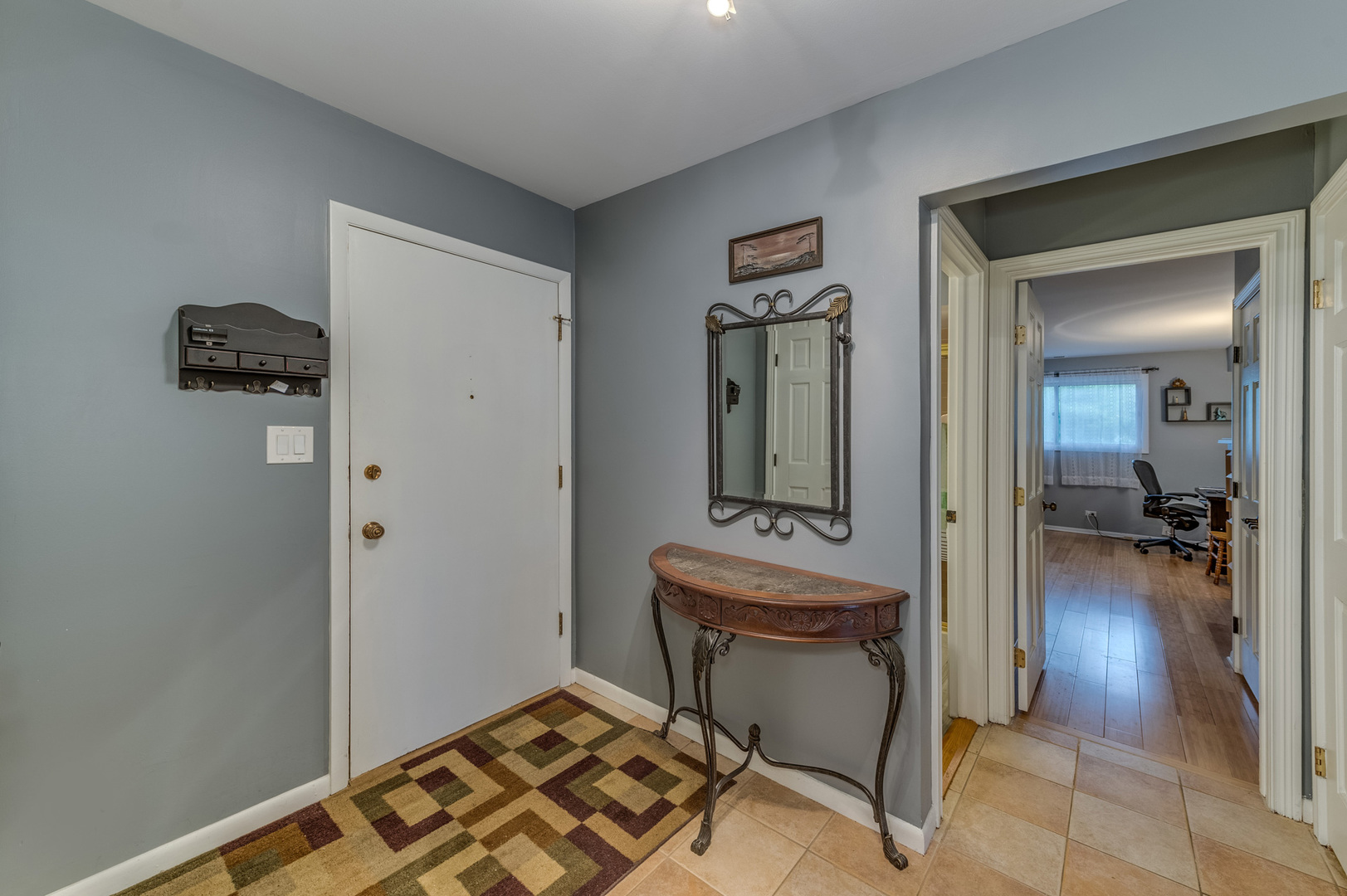 110 Green Bay Road, Unit 101 Glencoe, IL 60022 - Photo 5 of 31 a view of a room that has a bench in it